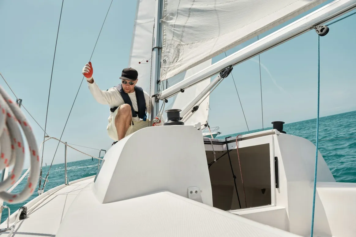 Homeowner on boat doing electrical grounding maintenance. 