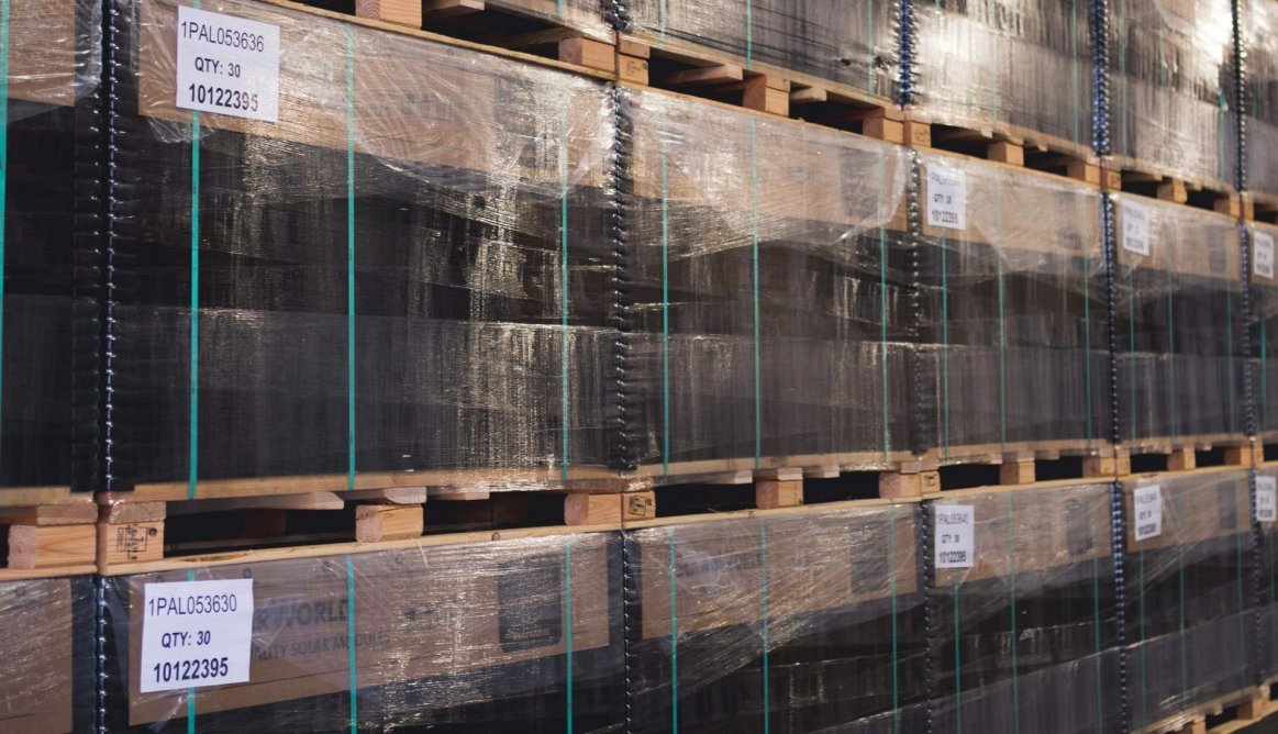 Solar panels stacked in warehouse