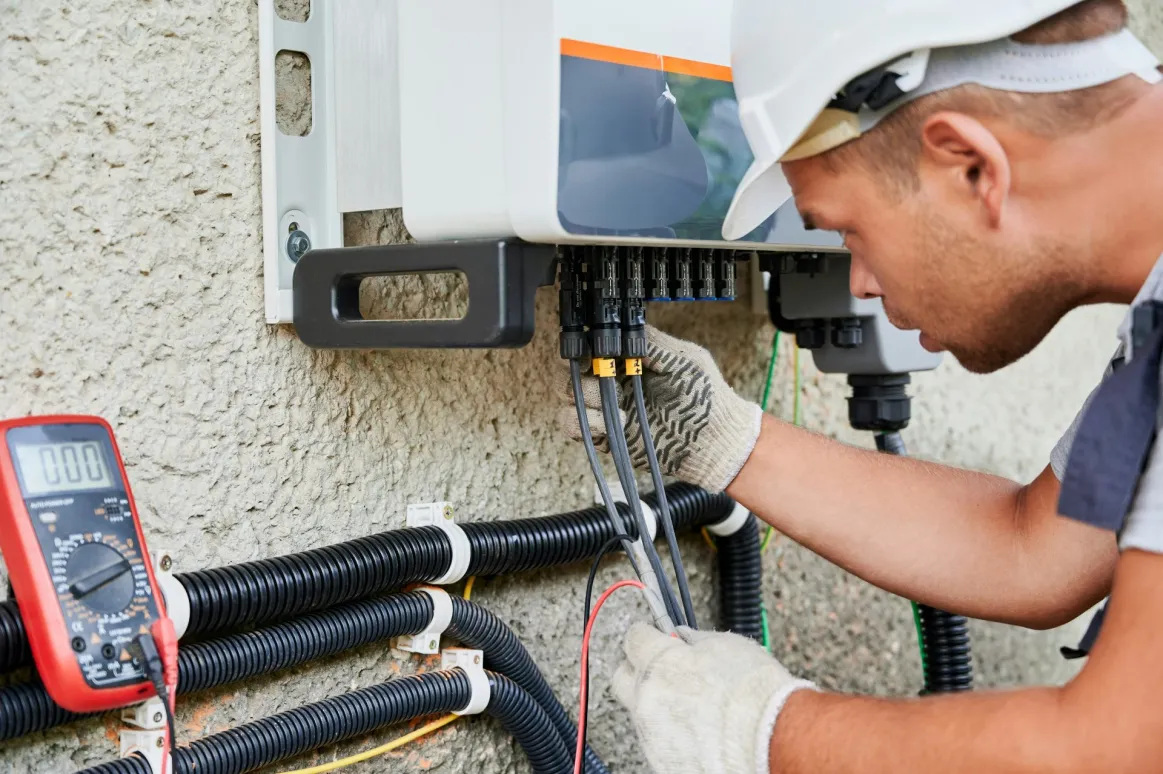 Solar installer working on interconnections. 