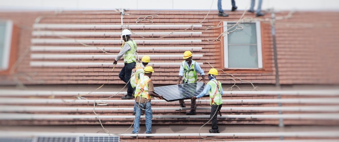 Solar Installers on Roof Header