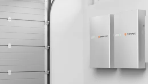 Enphase products displayed on the wall of a garage.