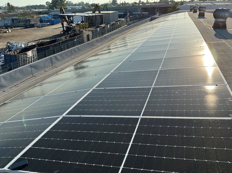 Solar panel installation on warehouse rooftop