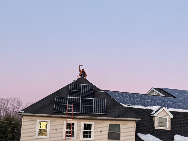 Sleeper Supermarket Solar Installer on Roof