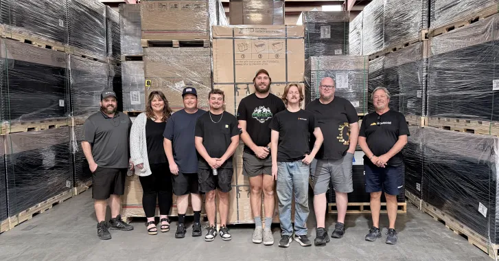 Greentech Renewables Pensacola team in warehouse.