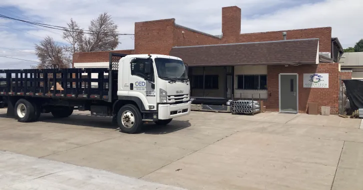 Greentech Renewables Pueblo building exterior and delivery truck.