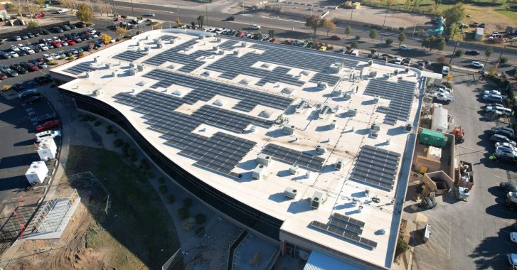Angled view of rooftop commercial solar installation in Albuquerque, NM.