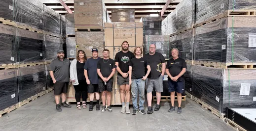 Greentech Pensacola team photo in warehouse.