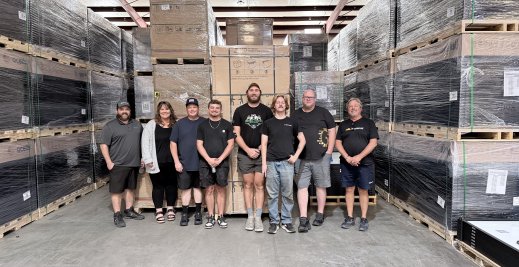 Greentech Pensacola team photo in warehouse.