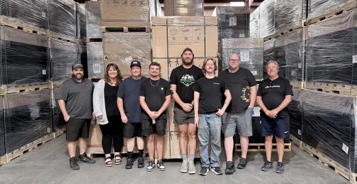 Greentech Renewables Pensacola team in warehouse.