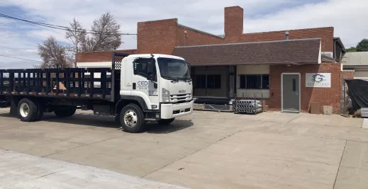 Greentech Renewables Pueblo building exterior and delivery truck.