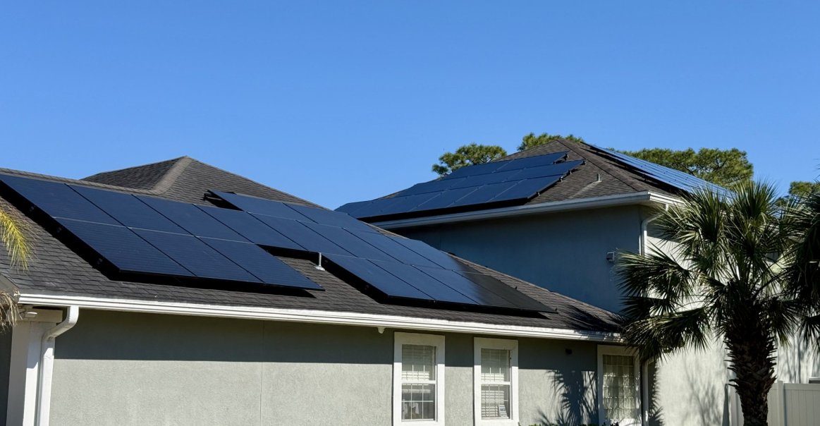 Home view of residential rooftop solar panel installation. 