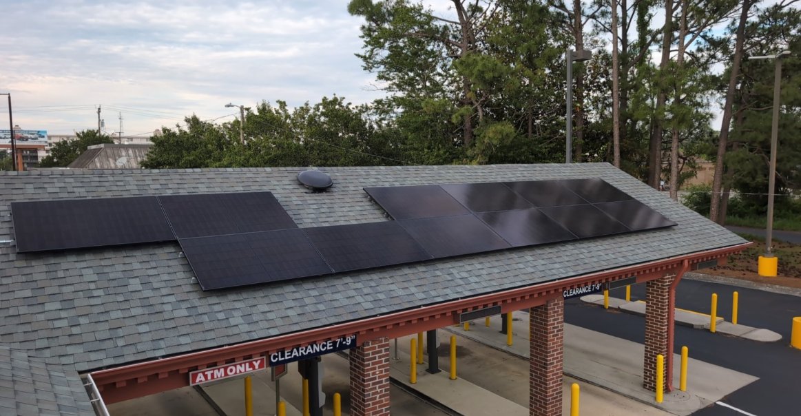 Rooftop view of commercial solar panel installation in North Carolina.