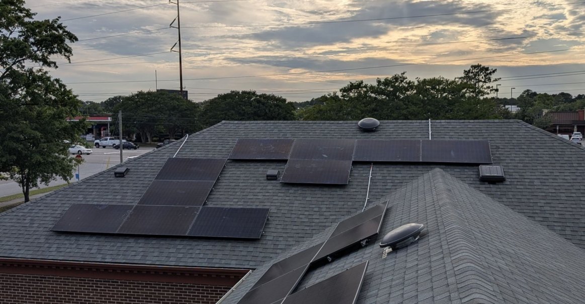 Sunset view of rooftop commercial solar project in Raleigh.