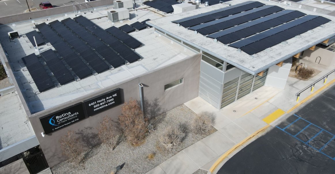 Rooftop view of commercial solar installation project at medical facility.