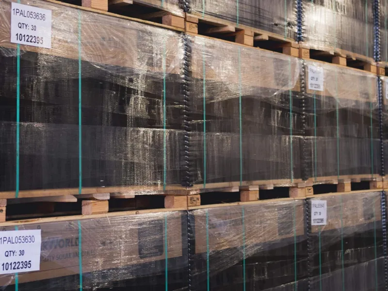 Solar panels stacked in warehouse