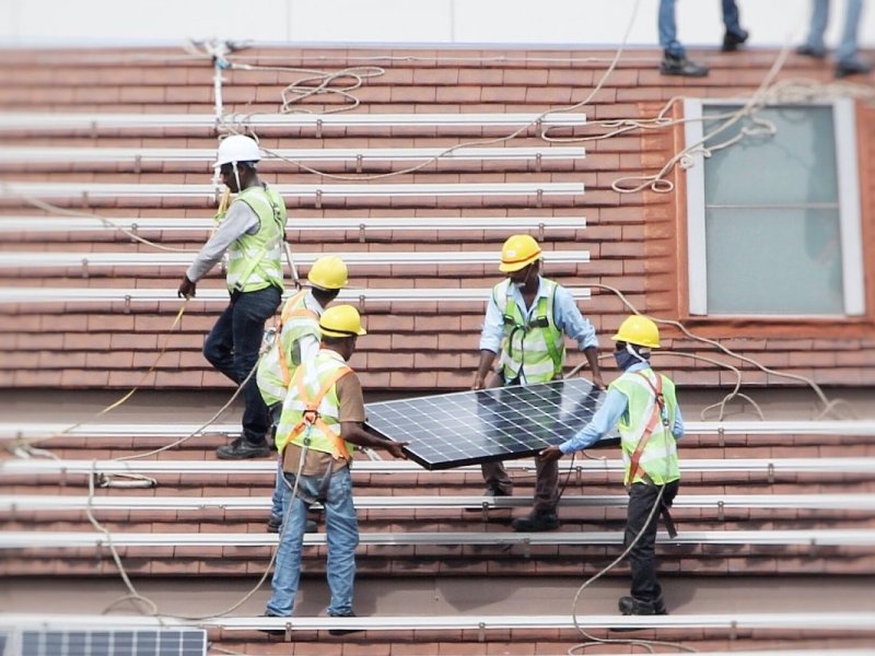 Solar Installers on Roof Header