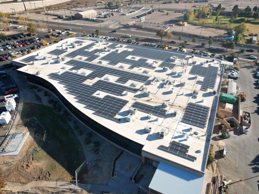Angled view of rooftop commercial solar installation in Albuquerque, NM.